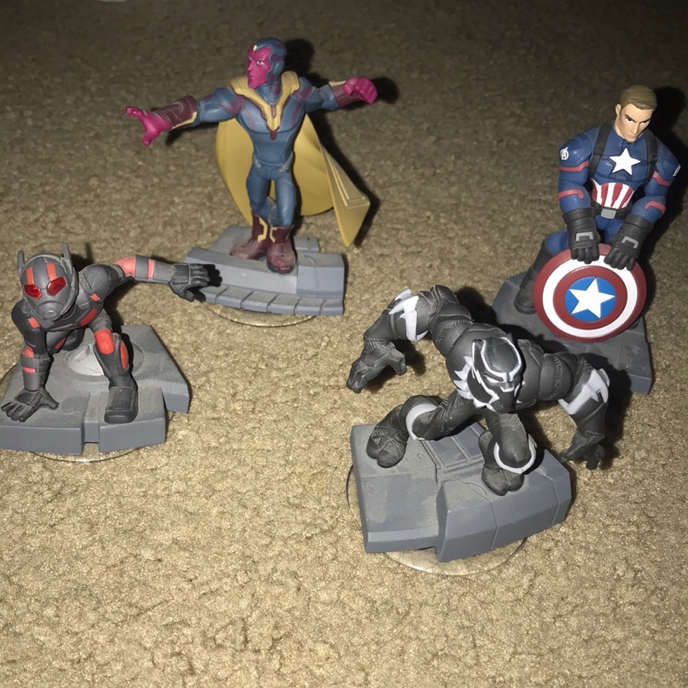 4 superhero game figures